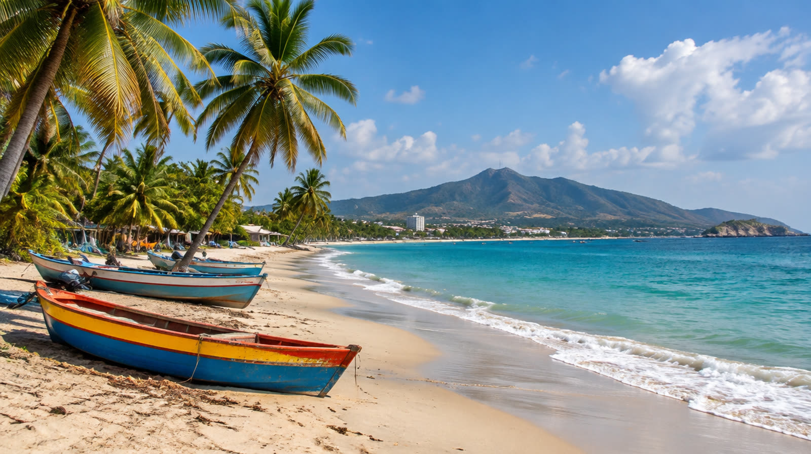 Palm-lined Caribbean beach with colorful fishing boats on Isla Margarita, Venezuela
